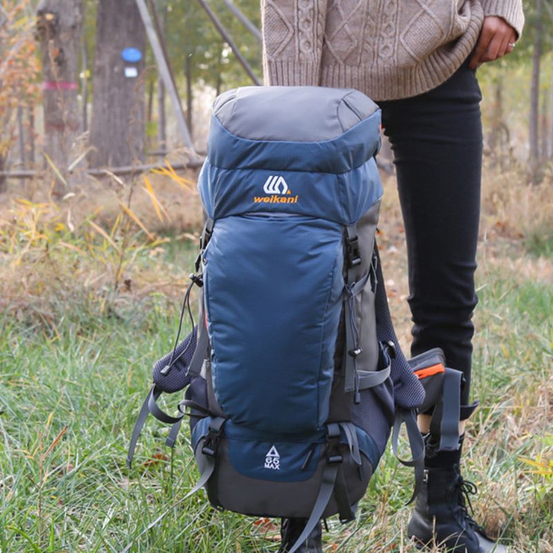 Sac à dos de randonnée 65L en nylon imperméable avec sangles ajustables, idéal pour le camping, l'escalade et le trekking