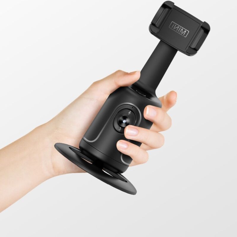 Support intelligent pour trépied de téléphone avec stabilisateur de cardan, rotation à 360° et suivi automatique du visage pour des prises de vue parfaites.